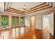 Spacious living room with hardwood floors, ceiling fan, and views of the yard at 1256 Spring Park Sw Dr, Atlanta, GA 30311