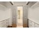 Walk-in closet with built in shelving and access to storage space at 1256 Spring Park Sw Dr, Atlanta, GA 30311