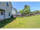 View of the home's grassy backyard with a wood fence, perfect for outdoor activities and relaxation at 1436 Arbor Place Dr, Morrow, GA 30260