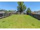 Large, grassy backyard enclosed by a wood fence, providing a secure and private outdoor space at 1436 Arbor Place Dr, Morrow, GA 30260