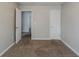 Empty bedroom featuring neutral walls, carpeted floor, and interior doors at 1436 Arbor Place Dr, Morrow, GA 30260