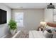 Bedroom featuring neutral walls, plush bedding, and a bright window for natural light at 1436 Arbor Place Dr, Morrow, GA 30260