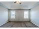 Spacious bedroom featuring plush carpet, a trey ceiling with fan, and natural light at 1436 Arbor Place Dr, Morrow, GA 30260