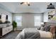 Virtually staged bedroom with trey ceiling, ceiling fan, and two windows at 1436 Arbor Place Dr, Morrow, GA 30260