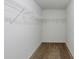 Walk-in closet with upper shelving, ready for organization at 1436 Arbor Place Dr, Morrow, GA 30260