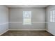 Inviting dining area featuring neutral walls and carpet, a large window, and a door to the yard at 1436 Arbor Place Dr, Morrow, GA 30260