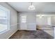 Open-concept dining area with a large window offering plenty of natural light and a door to the backyard at 1436 Arbor Place Dr, Morrow, GA 30260