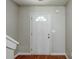 Bright entryway with wood flooring and a white front door with half-round window at 1436 Arbor Place Dr, Morrow, GA 30260