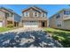 Two-story home with stone and brick front, attached two-car garage, and extended driveway at 1436 Arbor Place Dr, Morrow, GA 30260