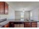 Practical kitchen area featuring plenty of counter space, stainless steel appliances and views to the dining area at 1436 Arbor Place Dr, Morrow, GA 30260