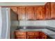 The kitchen features plenty of wood cabinetry and stainless steel refrigerator at 1436 Arbor Place Dr, Morrow, GA 30260