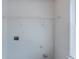Bright laundry room with shelving installed and hookups ready for your machines at 1436 Arbor Place Dr, Morrow, GA 30260
