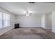Spacious living room with a fireplace and a ceiling fan, offering a cozy atmosphere at 1436 Arbor Place Dr, Morrow, GA 30260