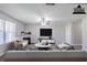 Inviting living room features a fireplace, ceiling fan, neutral walls and a plush seating arrangement at 1436 Arbor Place Dr, Morrow, GA 30260