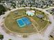 Aerial view of community amenities including a pool, clubhouse, and sports court at 2753 Trebek Ct, Mcdonough, GA 30253