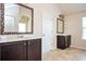 Bathroom featuring double sinks, dark cabinets, and bright neutral walls at 2753 Trebek Ct, Mcdonough, GA 30253