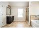 Beautiful bathroom with a large vanity, tiled shower and a garden tub at 2753 Trebek Ct, Mcdonough, GA 30253