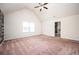 Large bedroom featuring vaulted ceilings, neutral walls and plush carpeting at 2753 Trebek Ct, Mcdonough, GA 30253