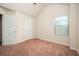 Bedroom with neutral walls, carpet, and a window for natural light at 2753 Trebek Ct, Mcdonough, GA 30253