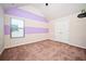 Bedroom with striped walls, carpet, window and closet at 2753 Trebek Ct, Mcdonough, GA 30253