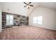 Spacious bedroom with a vaulted ceiling, wood accent wall, and large windows at 2753 Trebek Ct, Mcdonough, GA 30253