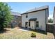 Rear exterior of the home with siding, a small patio, and partially fenced yard at 2753 Trebek Ct, Mcdonough, GA 30253