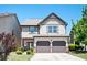 Charming two-story home with a two-car garage, manicured landscaping, and a welcoming front porch at 2753 Trebek Ct, Mcdonough, GA 30253