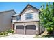 Charming two-story home with a two-car garage, manicured landscaping, and a welcoming front porch at 2753 Trebek Ct, Mcdonough, GA 30253