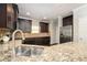 Bright kitchen with stainless steel appliances, granite countertops, and tile backsplash at 2753 Trebek Ct, Mcdonough, GA 30253