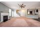 Large living room features a fireplace and view of the kitchen and staircase at 2753 Trebek Ct, Mcdonough, GA 30253