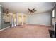 Spacious living area with decorative columns and open access to the kitchen at 2753 Trebek Ct, Mcdonough, GA 30253