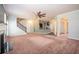 Open-concept living room boasts a fireplace, staircase, and arched doorways at 2753 Trebek Ct, Mcdonough, GA 30253