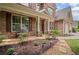 Charming brick home with manicured landscaping and a welcoming front porch at 2955 Pleasant Valley Trl, Cumming, GA 30028