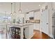 Open kitchen featuring a large center island, stainless appliances, and pendant lighting at 2955 Pleasant Valley Trl, Cumming, GA 30028