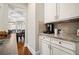 Hallway between the kitchen and formal dining room showcases storage and countertop space at 2955 Pleasant Valley Trl, Cumming, GA 30028