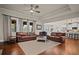 Spacious living room features hardwood floors, ample seating and an open floor plan at 2955 Pleasant Valley Trl, Cumming, GA 30028