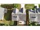 Aerial view showcasing the property's backyard with a patio, a fenced yard, and landscaping at 3259 Mcever Park Cir, Acworth, GA 30101