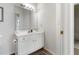 Well-lit bathroom with a vanity, a large mirror, and classic white fixtures at 3259 Mcever Park Cir, Acworth, GA 30101
