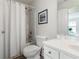 Bright bathroom with a shower-tub combo and white fixtures at 3259 Mcever Park Cir, Acworth, GA 30101