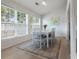Cozy dining room with hardwood floors, bright natural light, and seating for six at 3259 Mcever Park Cir, Acworth, GA 30101