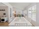 Well-lit dining room with hardwood floors and bright windows overlooking the front yard at 3259 Mcever Park Cir, Acworth, GA 30101