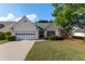 Charming single-story home with a well-manicured lawn, two car garage, and mature landscaping at 3259 Mcever Park Cir, Acworth, GA 30101