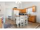 Bright kitchen features wooden cabinets, an island with seating, and modern appliances at 3259 Mcever Park Cir, Acworth, GA 30101