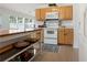 Charming kitchen featuring wooden cabinets, an oven, and a central island at 3259 Mcever Park Cir, Acworth, GA 30101