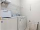 Bright laundry room featuring a modern washer and dryer with ample storage space and convenient shelving at 3259 Mcever Park Cir, Acworth, GA 30101
