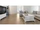 Open-concept living room with hardwood floors, neutral tones, and a seamless flow at 3259 Mcever Park Cir, Acworth, GA 30101
