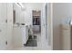 Bathroom with a double sink vanity and a hallway leading to the walk-in closet at 3259 Mcever Park Cir, Acworth, GA 30101