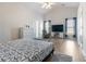Inviting bedroom with wood floors, television, vaulted ceilings and natural light from the windows at 3259 Mcever Park Cir, Acworth, GA 30101