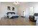 Spacious main bedroom with a vaulted ceiling, wood floors, a ceiling fan, and a connecting bathroom at 3259 Mcever Park Cir, Acworth, GA 30101