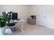 Functional home office with a modern desk setup and a view of a storage cabinet at 3259 Mcever Park Cir, Acworth, GA 30101